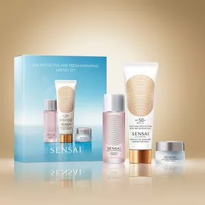 Sun Protective and Hydrating Limited set arranged beside the product box on abstract gold background